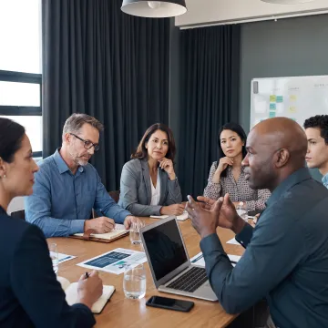 Professionals practicing persuasive communication in a workshop