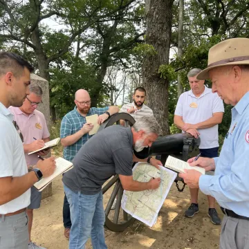 Facilitator leading a small leadership group