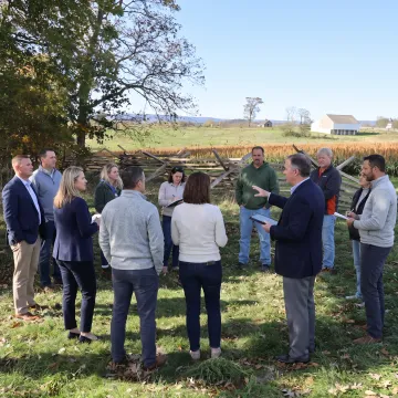 Mid-career leaders participating in an outdoor leadership discussion