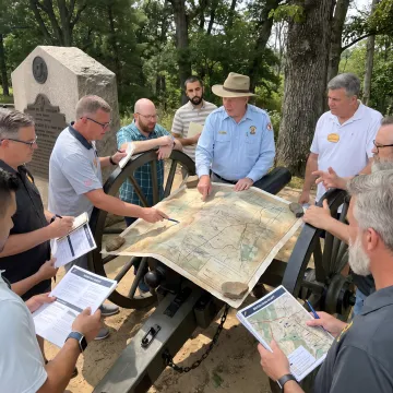 Facilitator guiding leaders through a historical leadership exercise