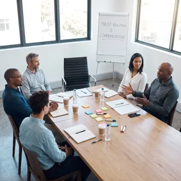 Leadership team collaborating during a trust-building workshop