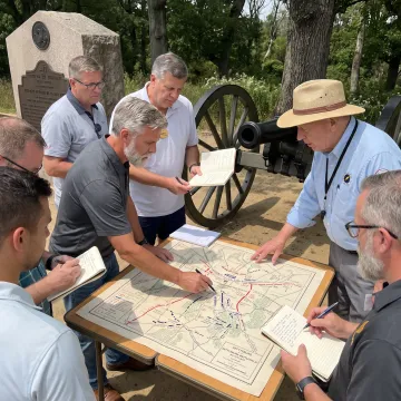 Facilitator guiding leaders through a high-pressure scenario