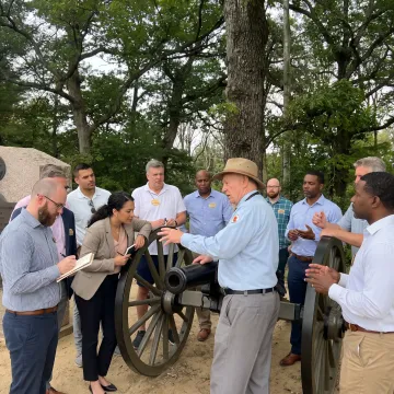 Leadership team participating in an outdoor training discussion