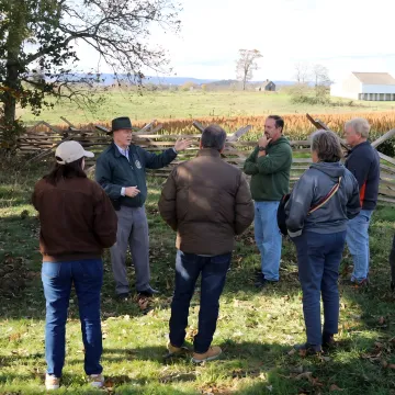 Facilitator leading leaders through an outdoor strategy discussion