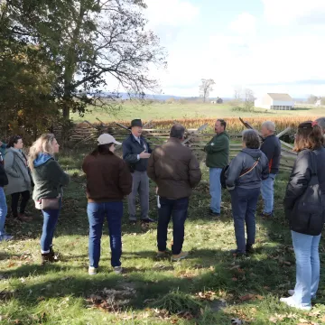 Facilitator leading a leadership discussion outdoors