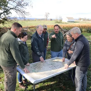 Business leaders collaborating during an outdoor workshop