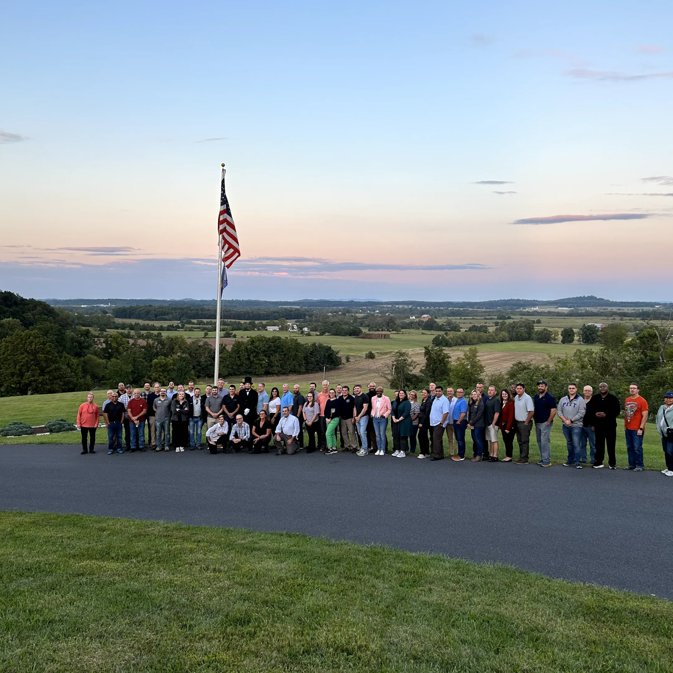 Facilitator leading corporate leaders through an experiential learning discussion