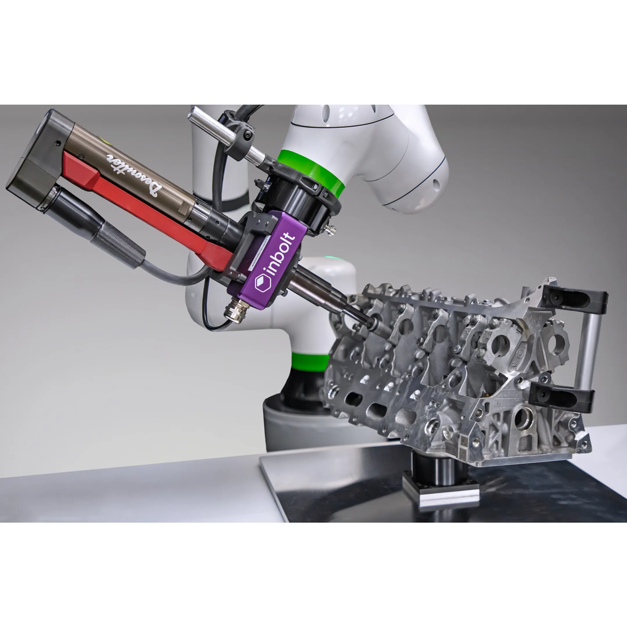 Engineer reviewing robotic assembly automation
