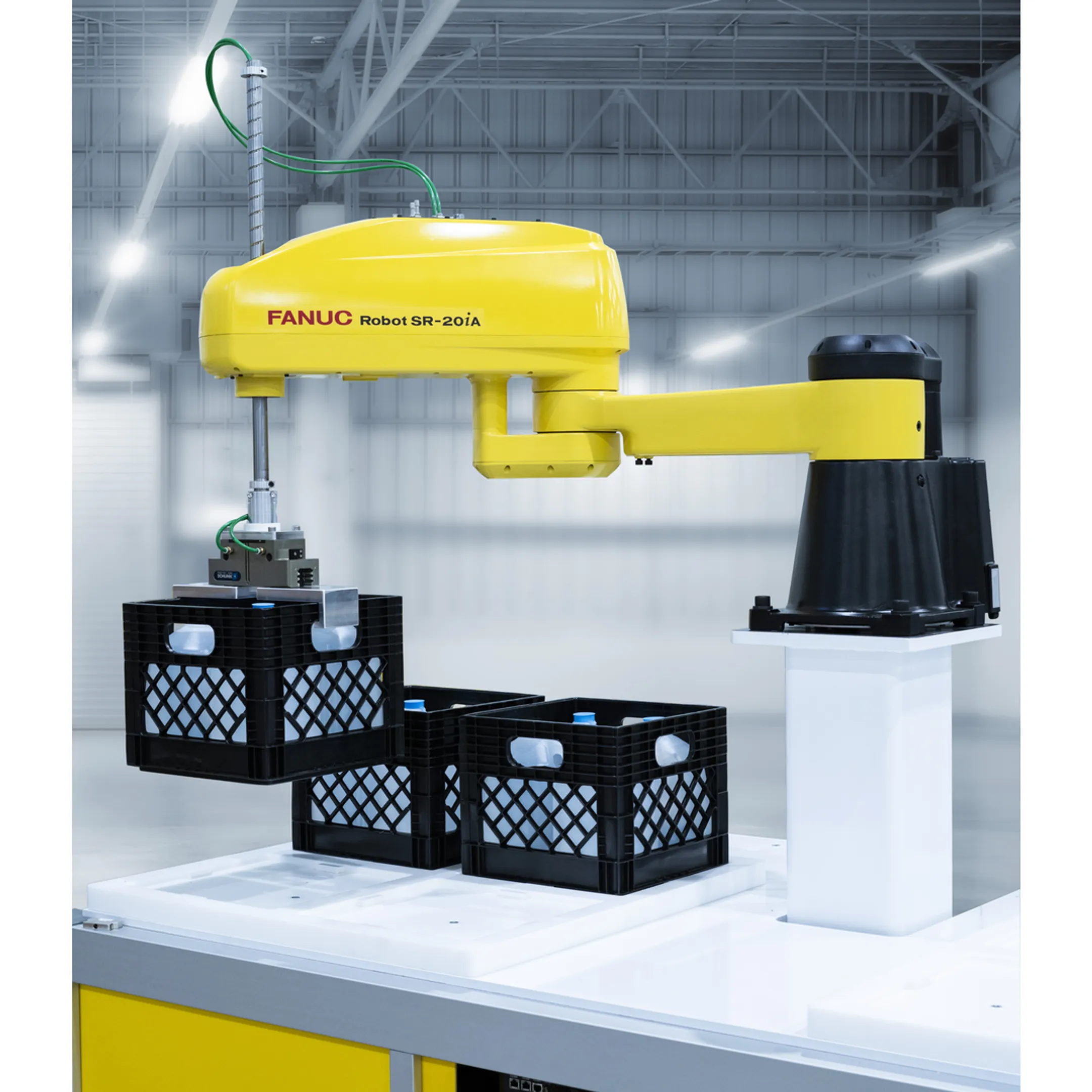 Engineer programming an industrial material handling robot