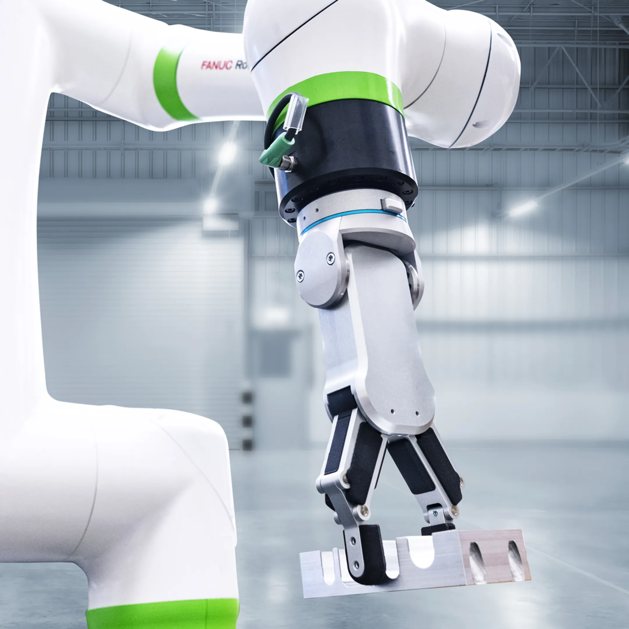 Engineer reviewing a robotic conveyor handling system