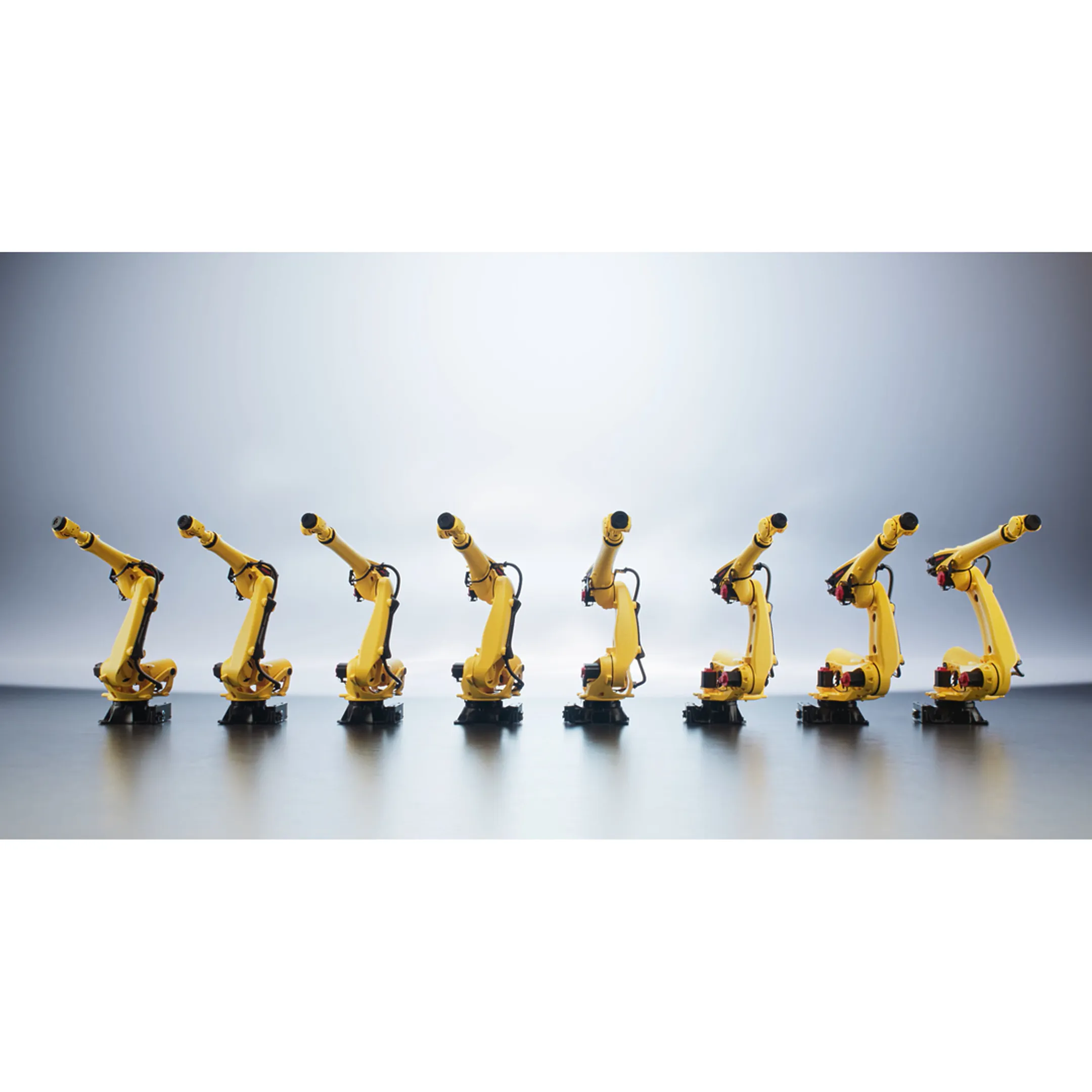 Technician programming an industrial robot