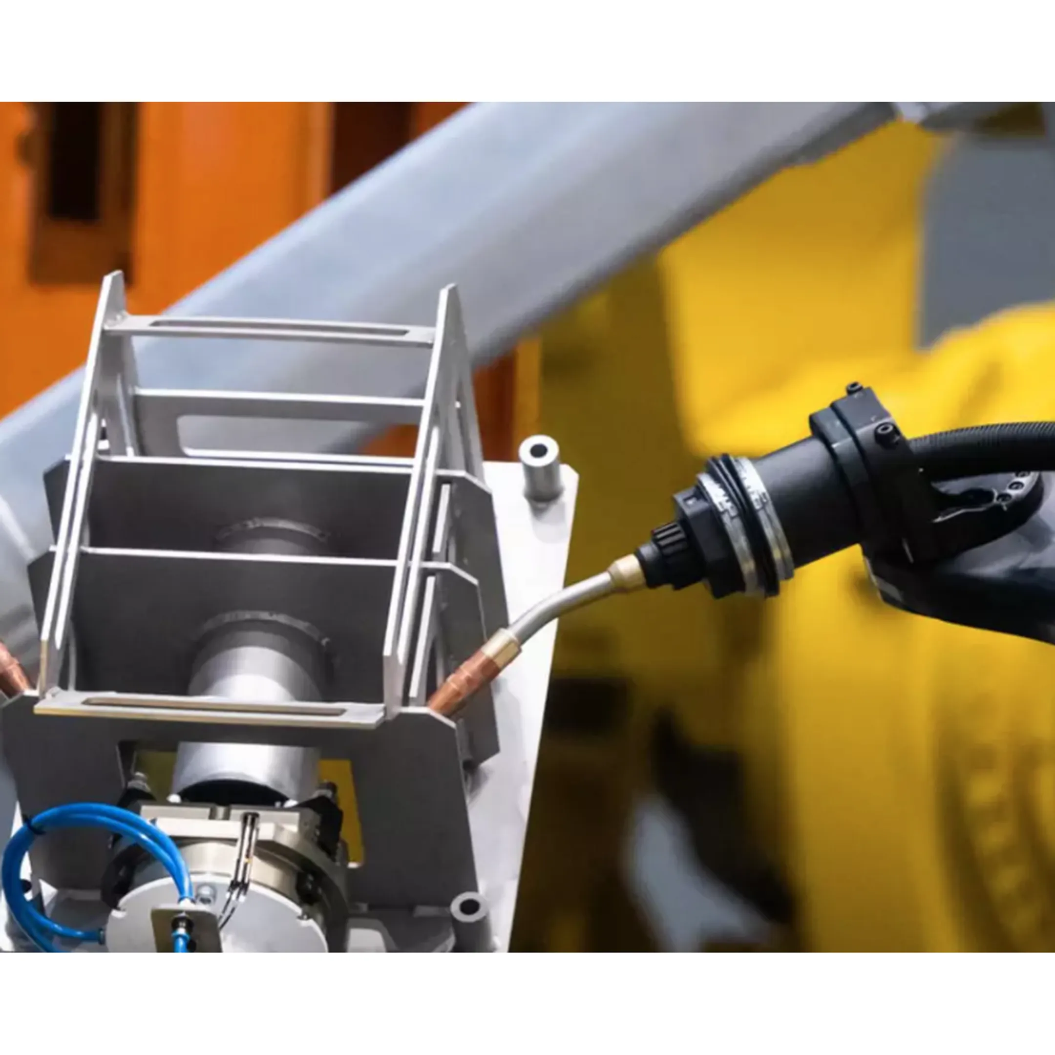 Engineer reviewing a robotic welding cell