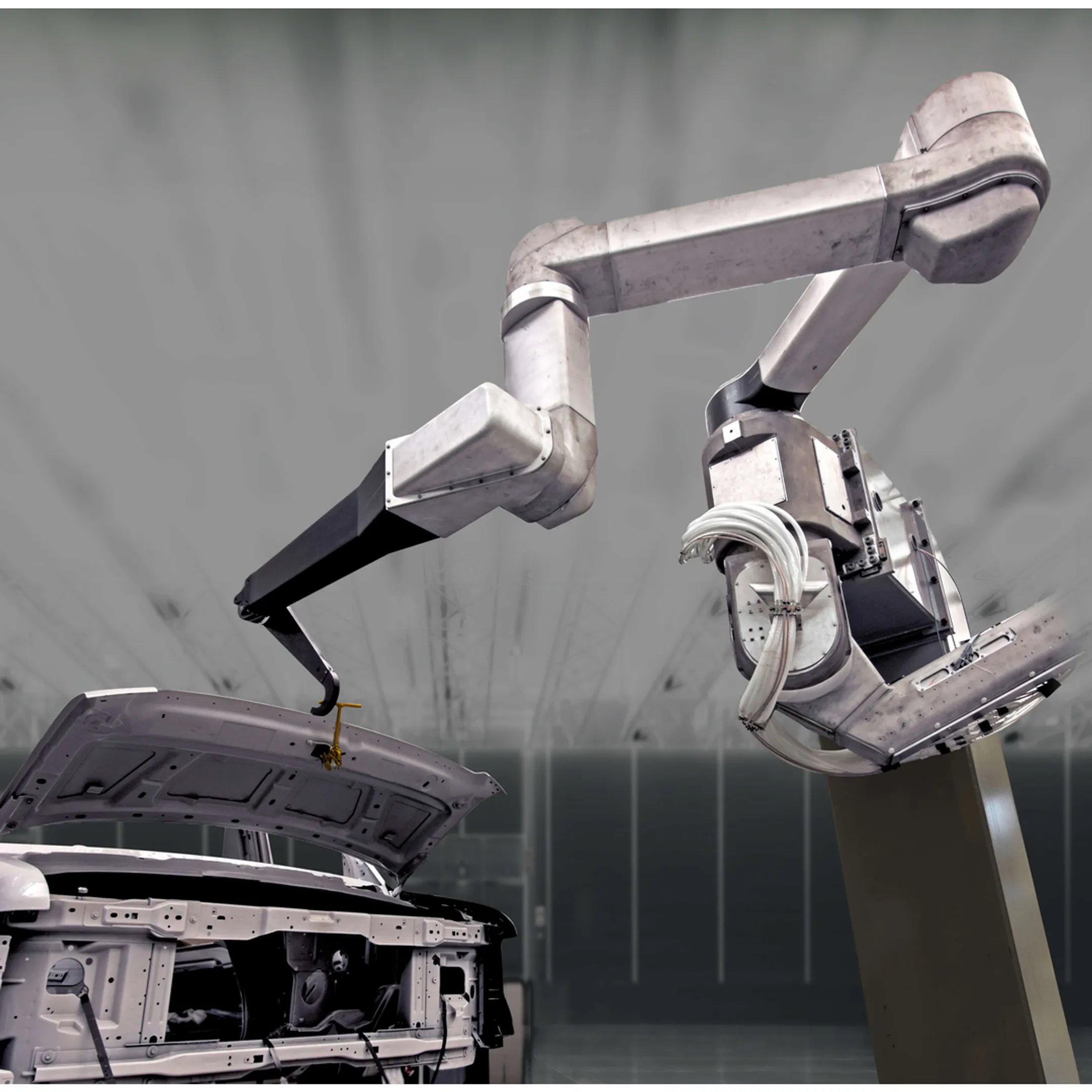 Engineer reviewing robotic cell simulation