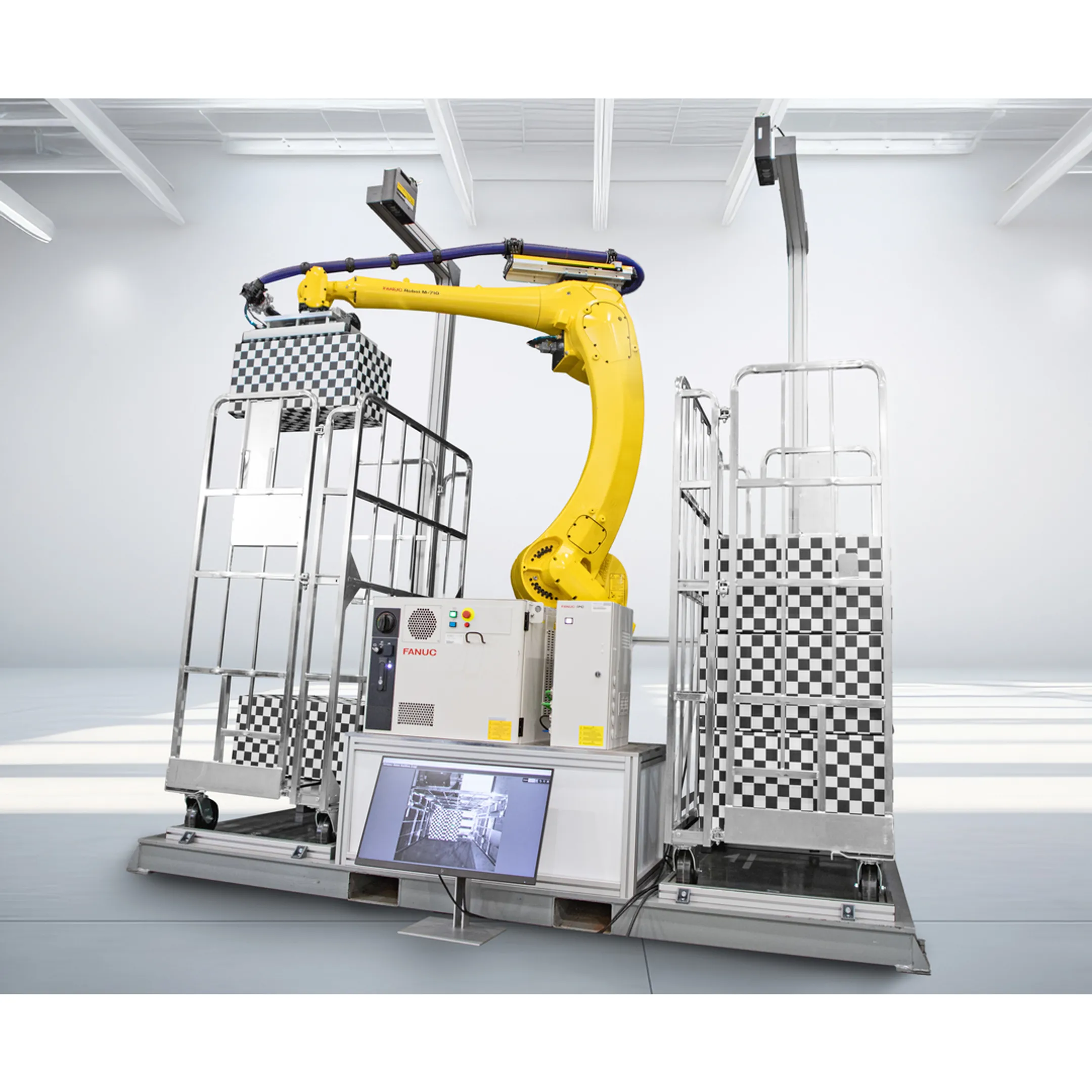 Engineer reviewing a robotic pallet handling system