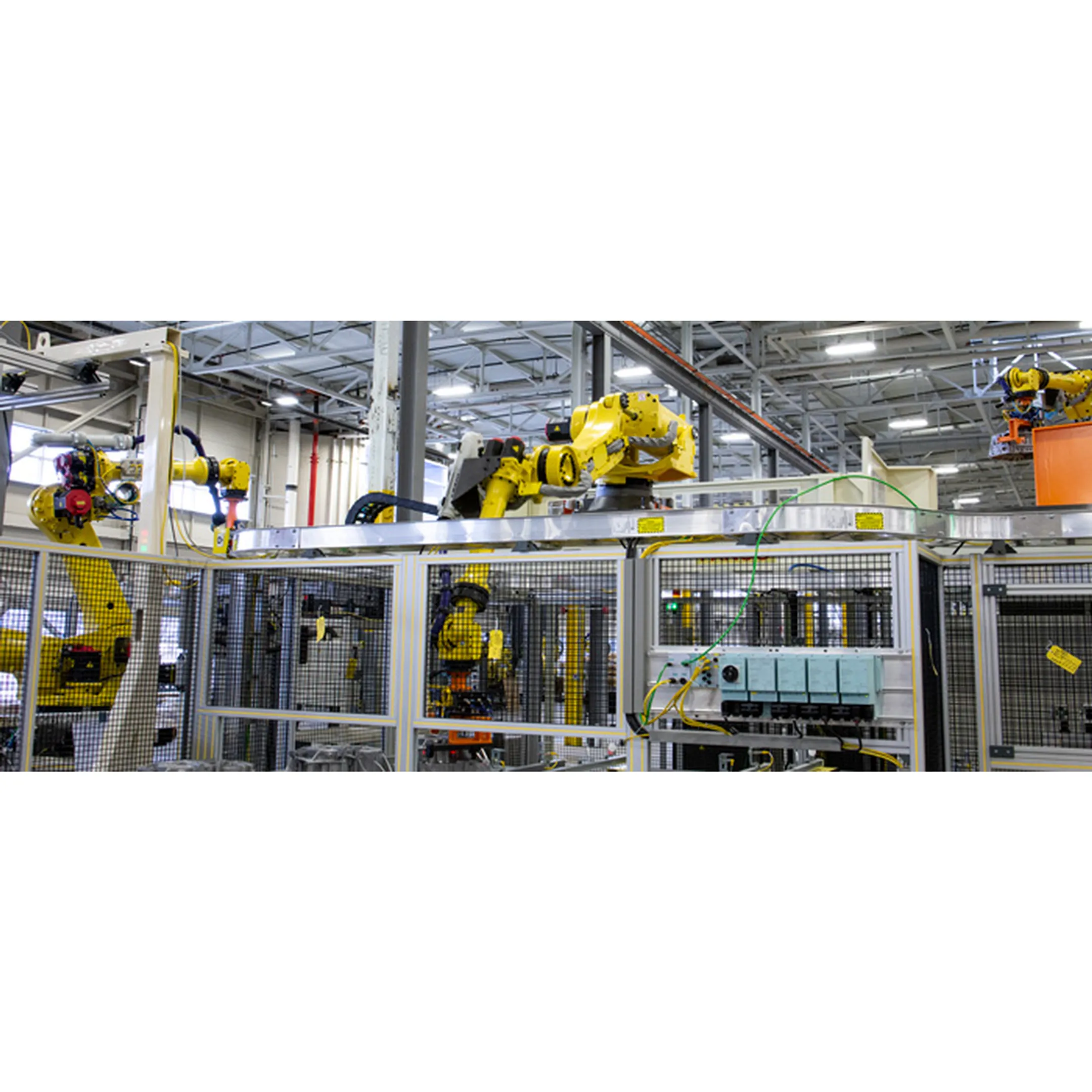 Engineer reviewing robotic material handling cell