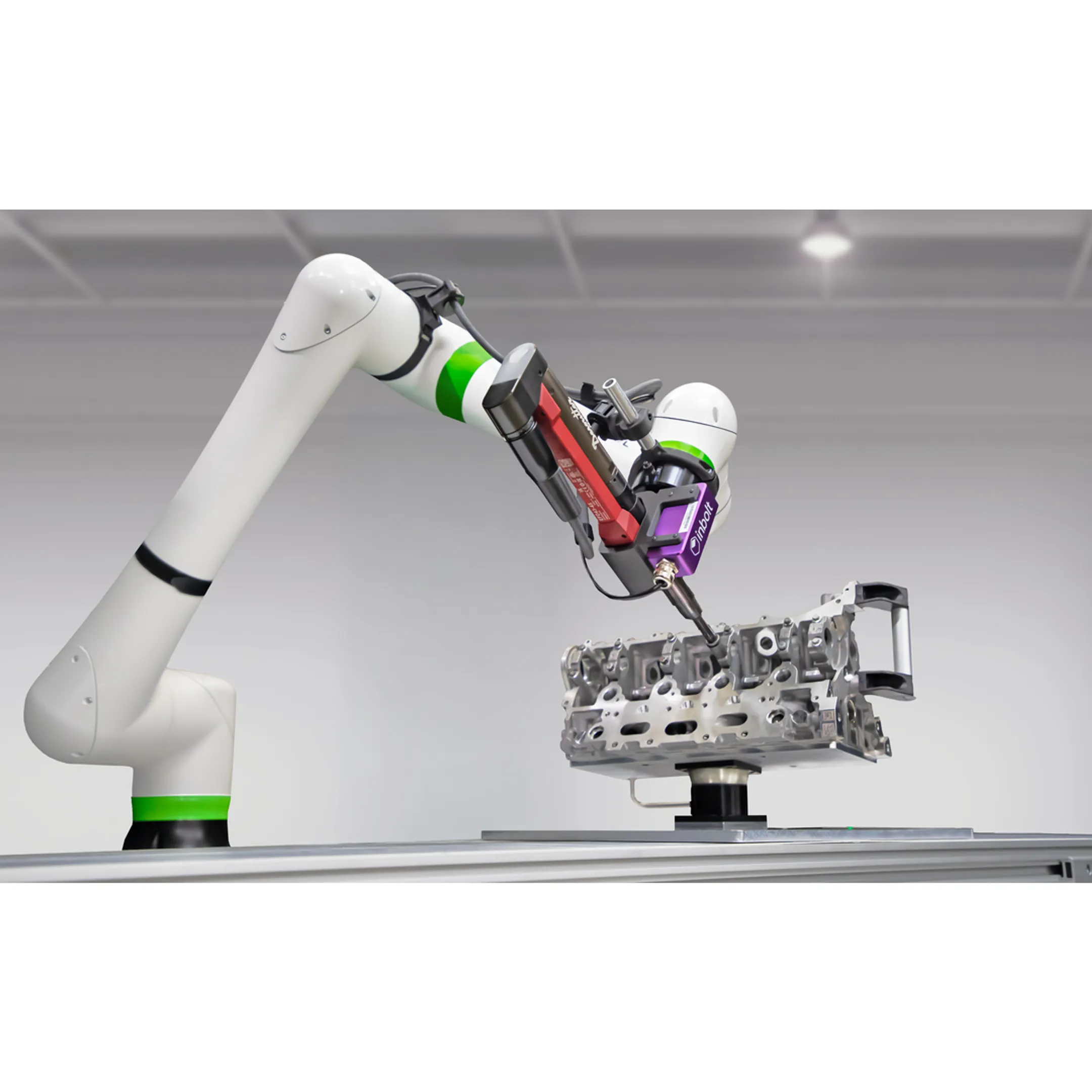 Engineer reviewing a robotic assembly system
