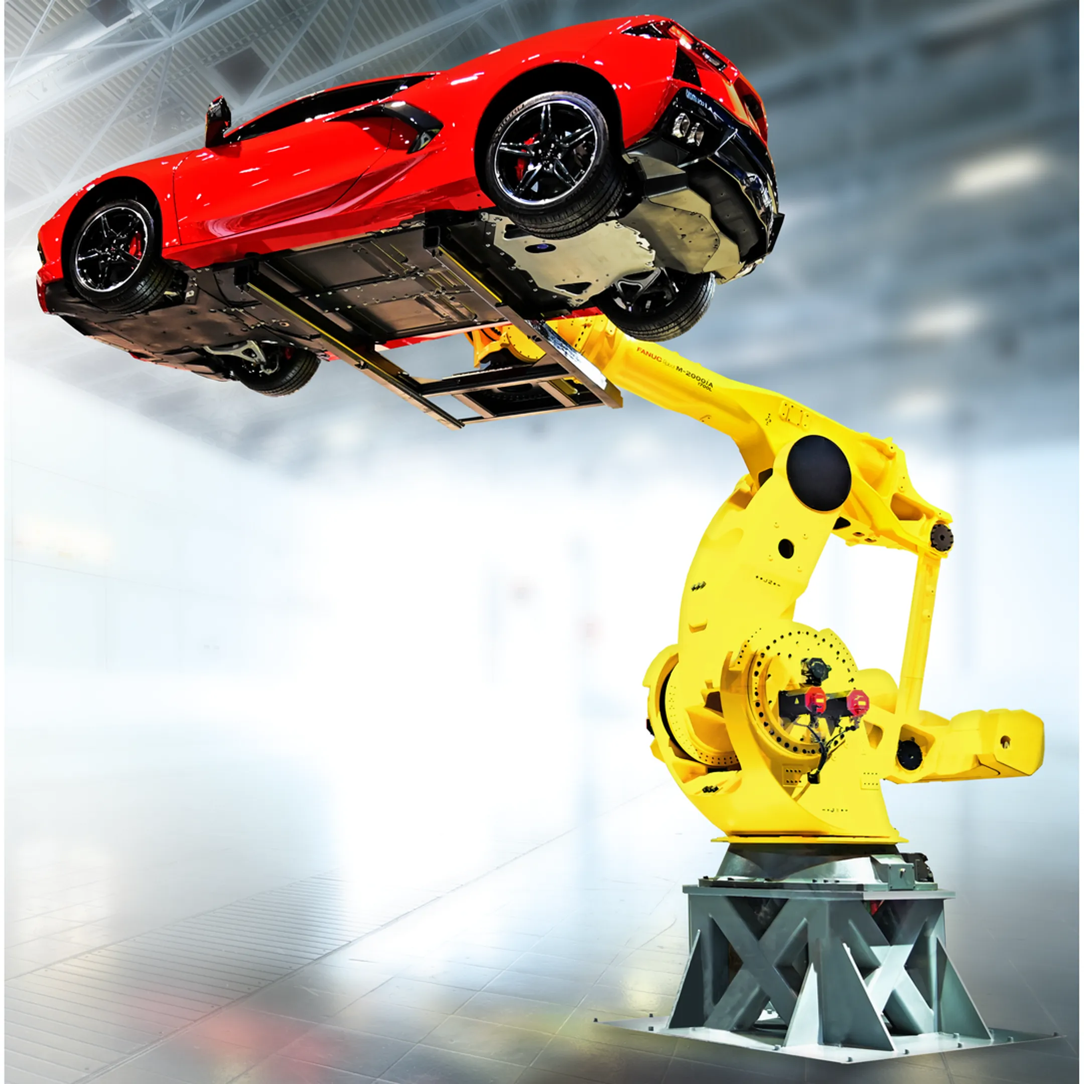 Engineers reviewing robotic material handling cell