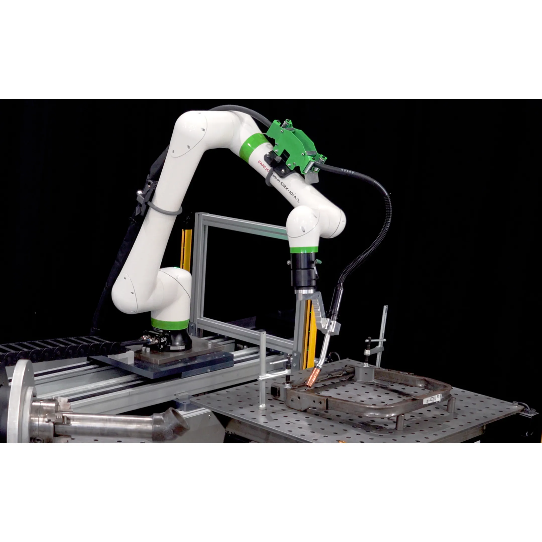 Engineers reviewing a robotic welding cell