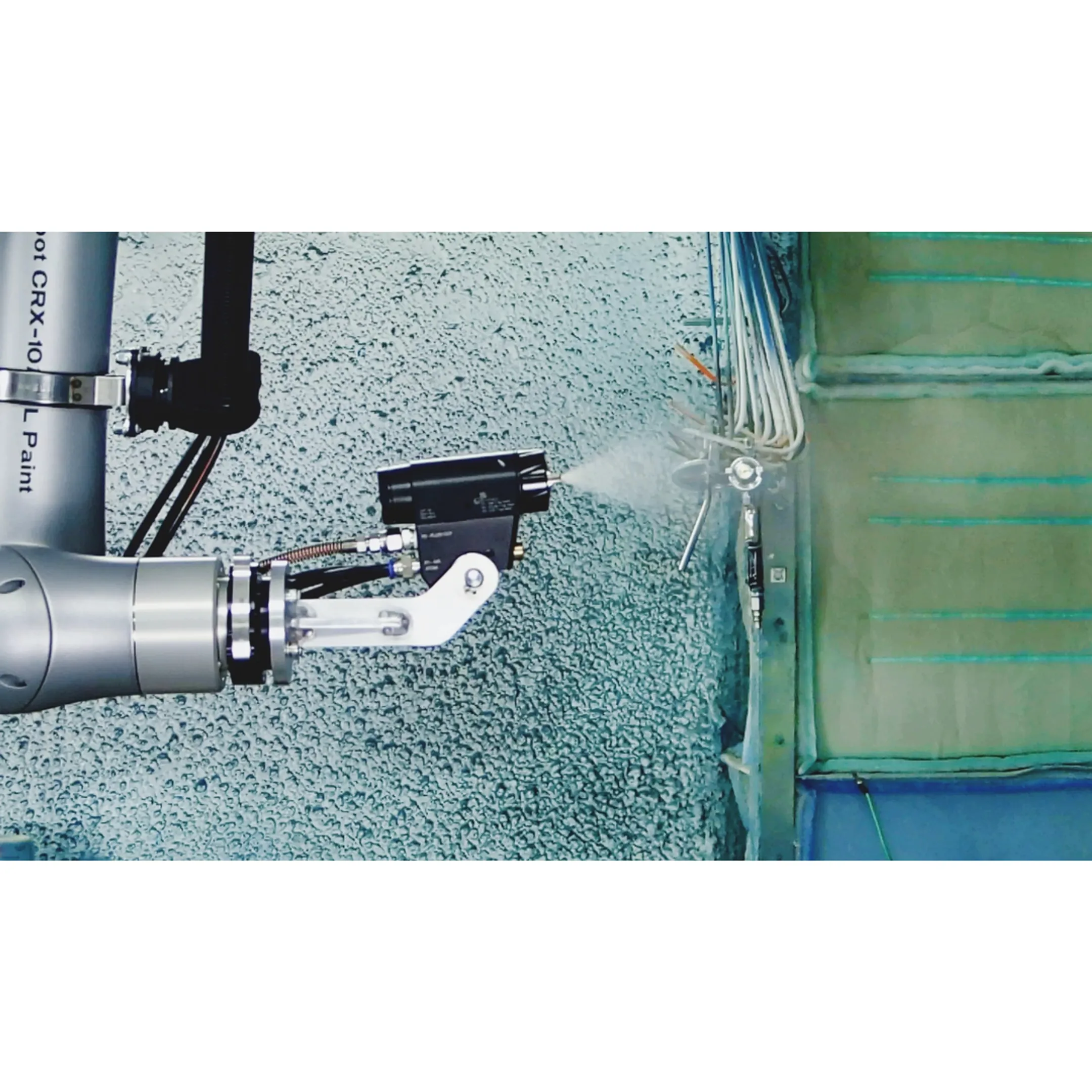 Engineer reviewing robotic paint system programming
