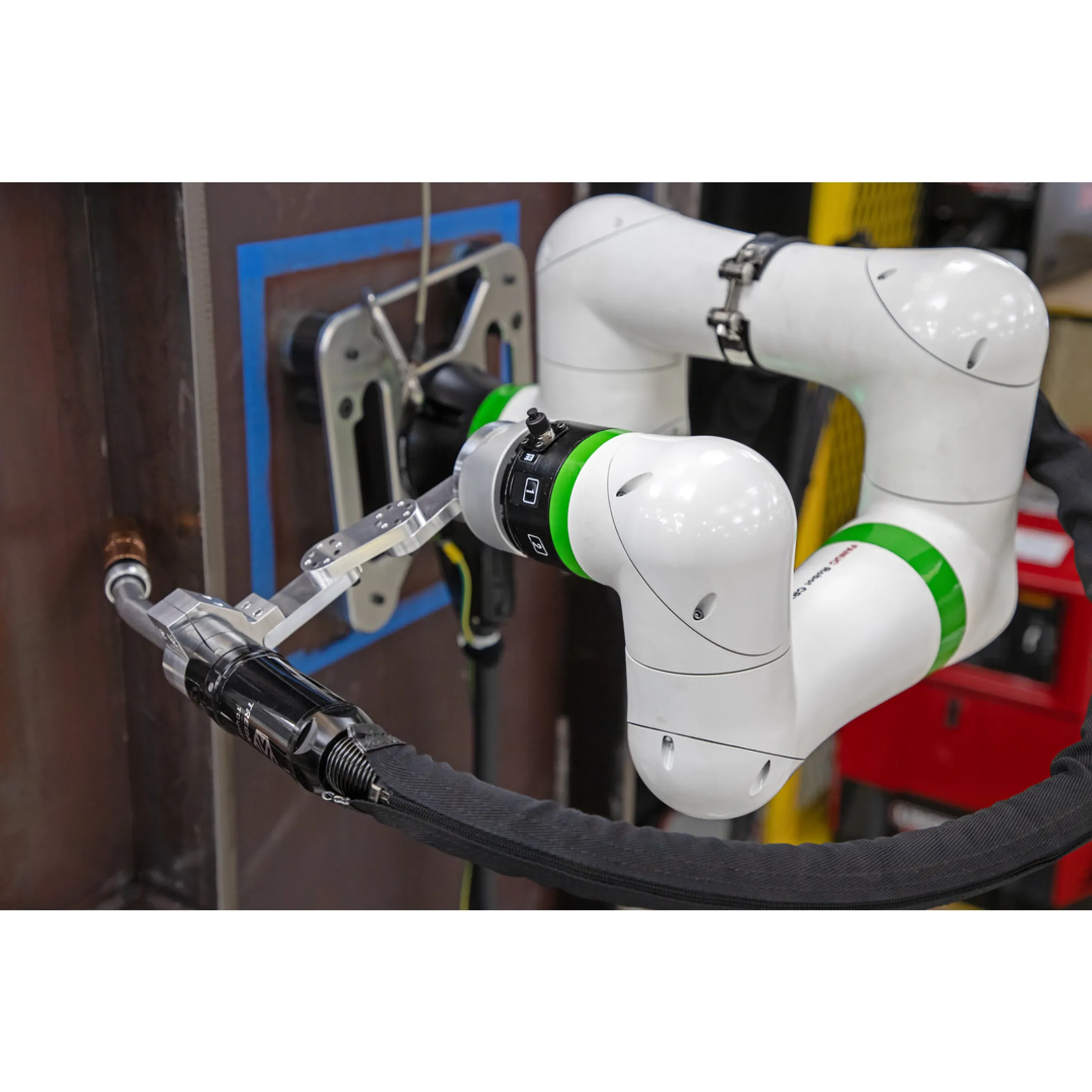 Engineer reviewing an automotive robotic welding system