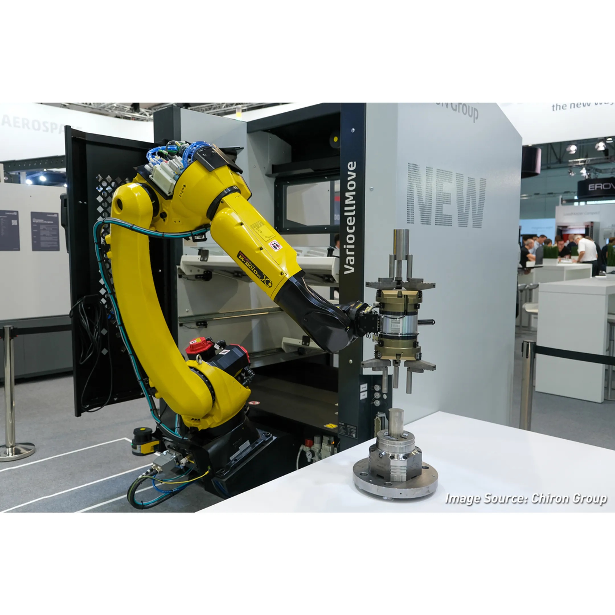 Engineer programming a robotic production cell