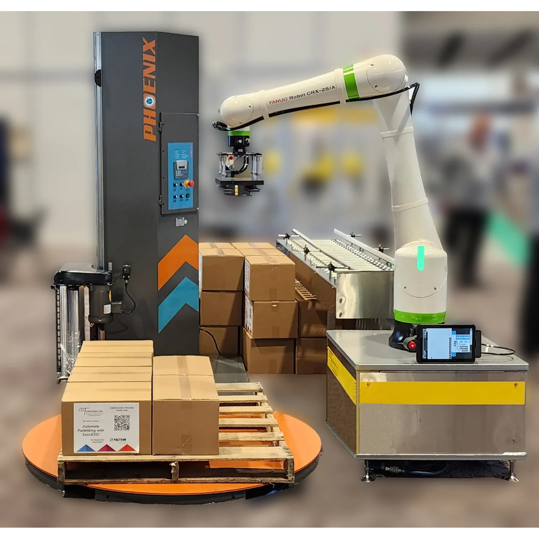 Engineers reviewing a robotic packaging cell