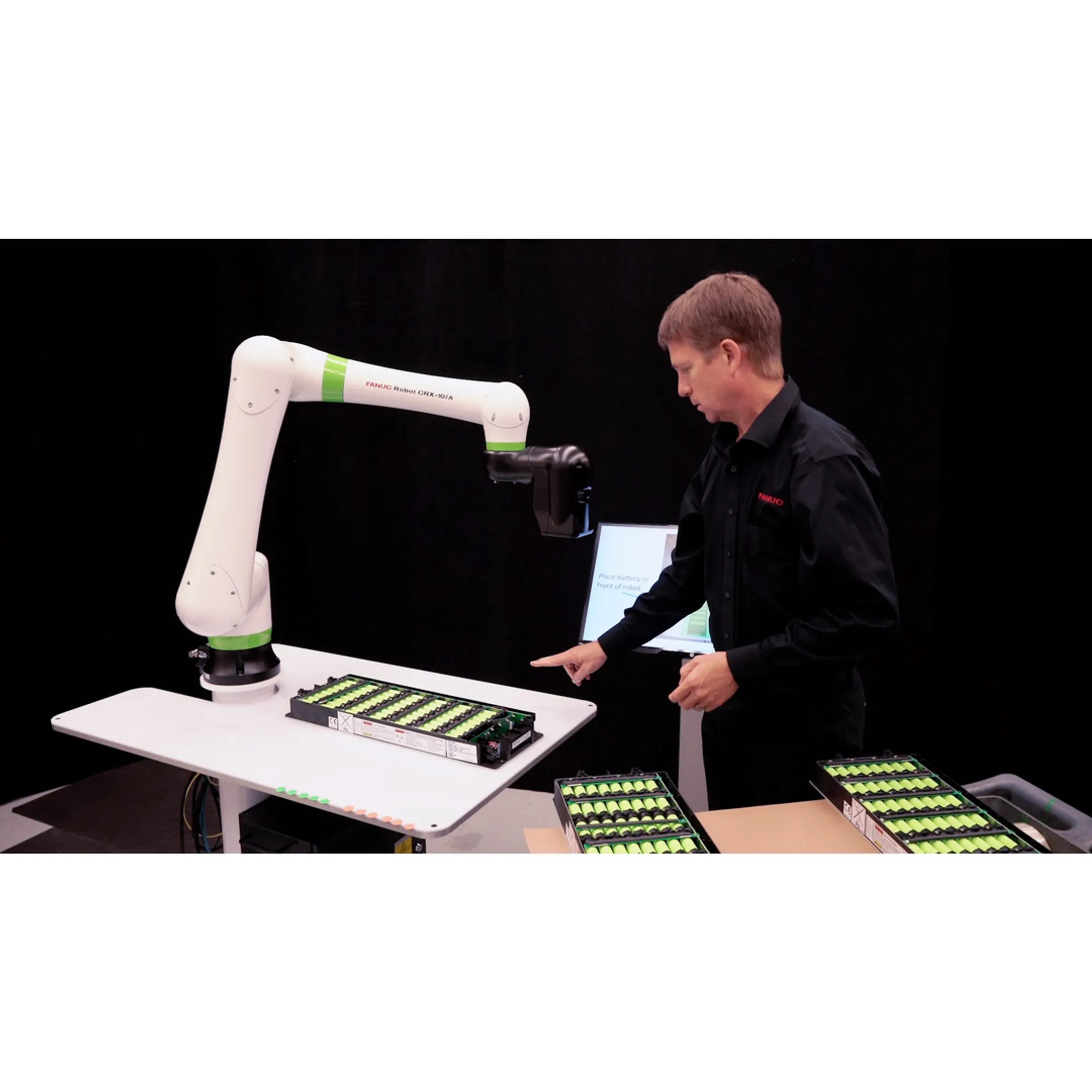 Engineer reviewing a robotic vision sorting cell