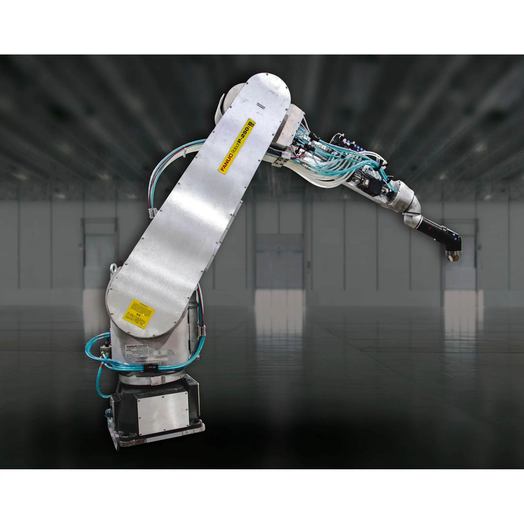 Engineer programming a robotic industrial paint system