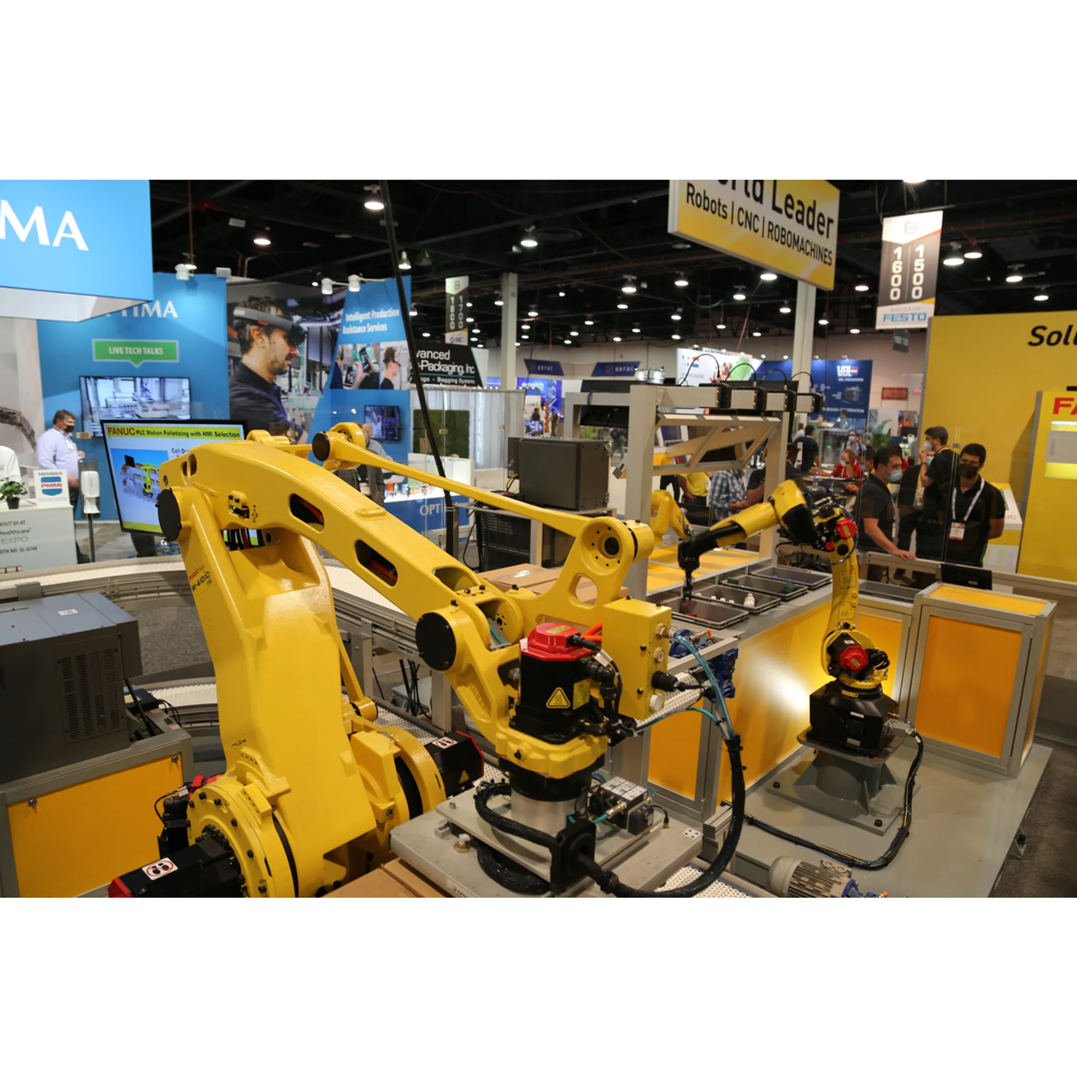 Engineer reviewing a robotic handling cell