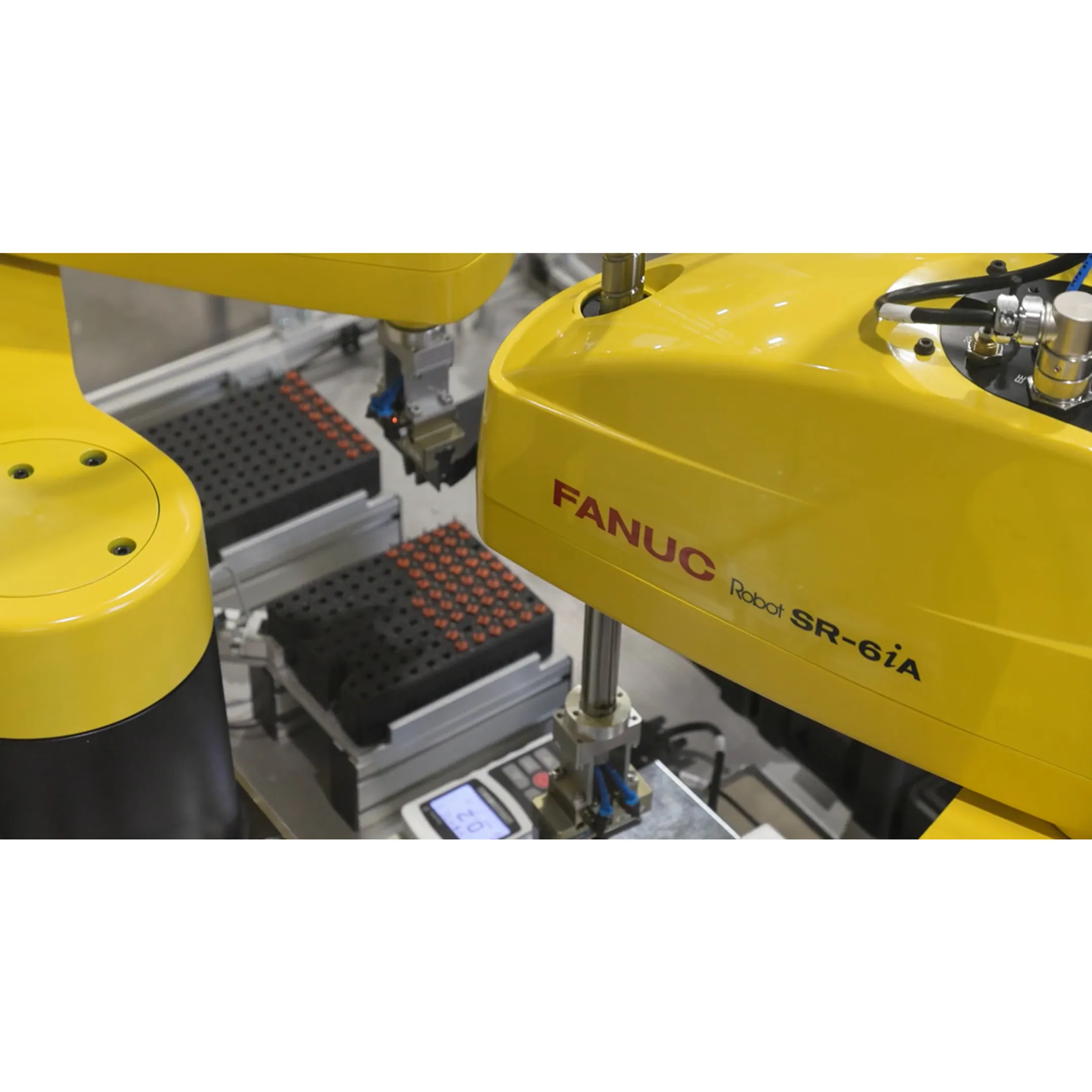 Engineer programming a robotic material handling system