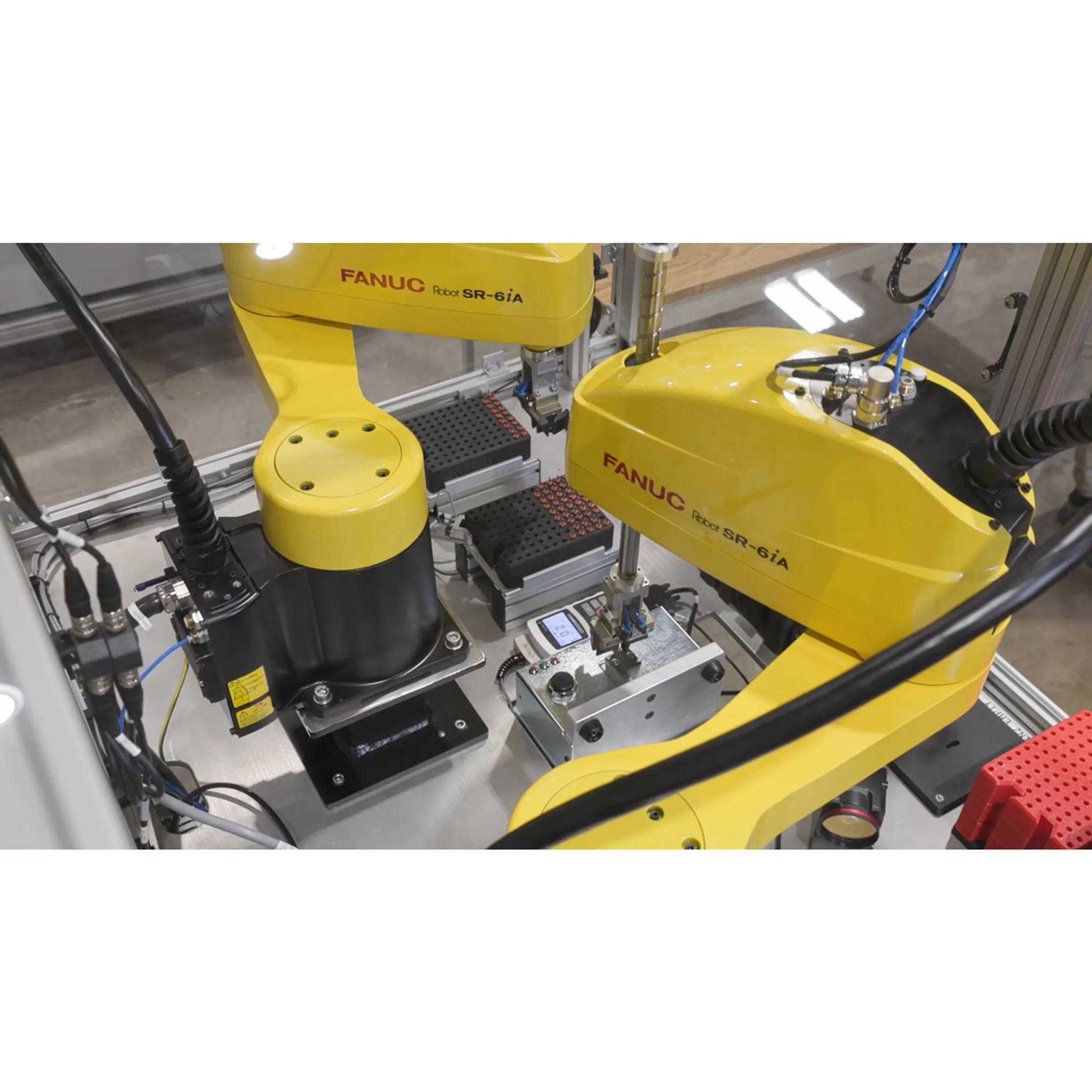 Engineer programming a robotic assembly system