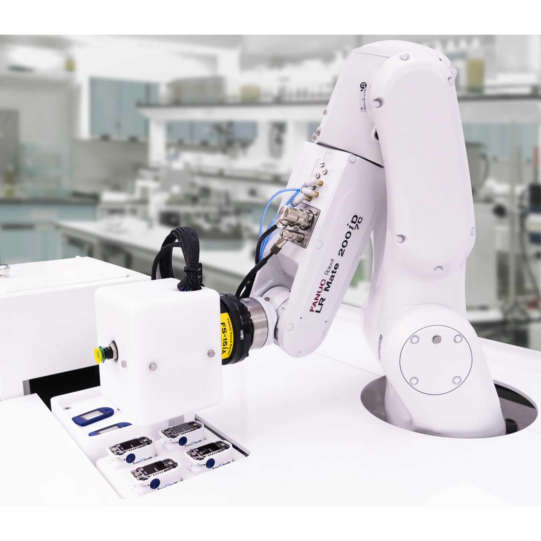 Engineer reviewing robotic assembly system