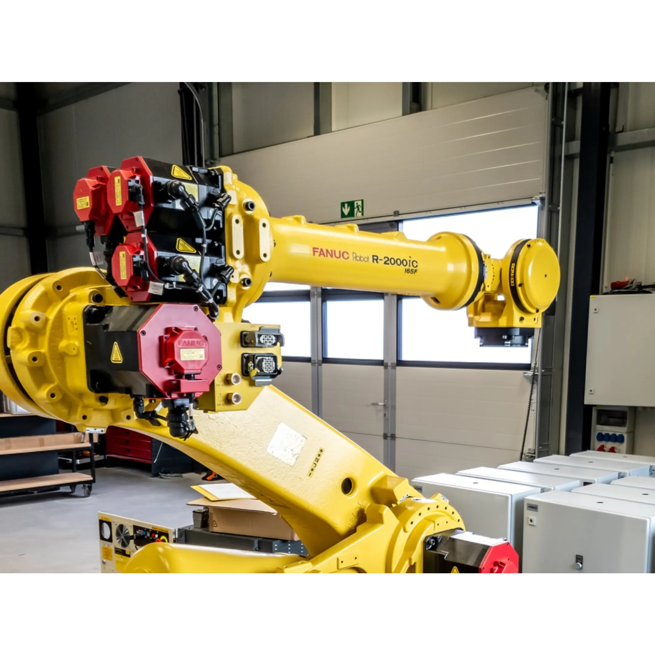 Engineer reviewing robotic assembly quality data