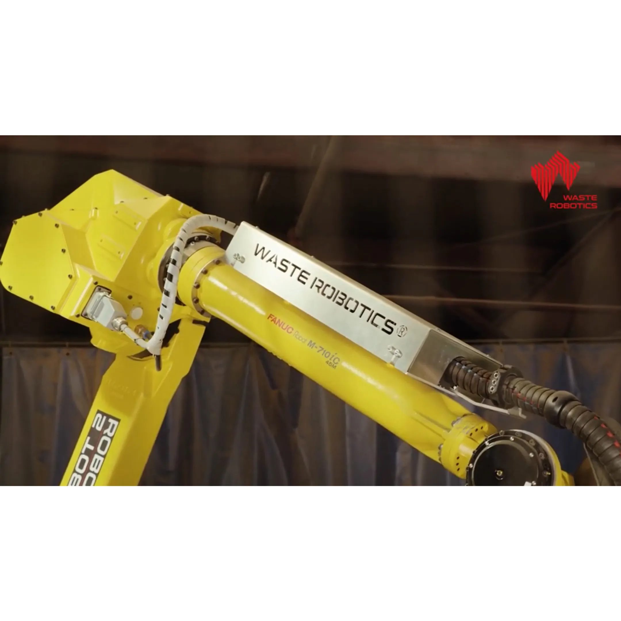 Engineer reviewing a robotic material flow cell