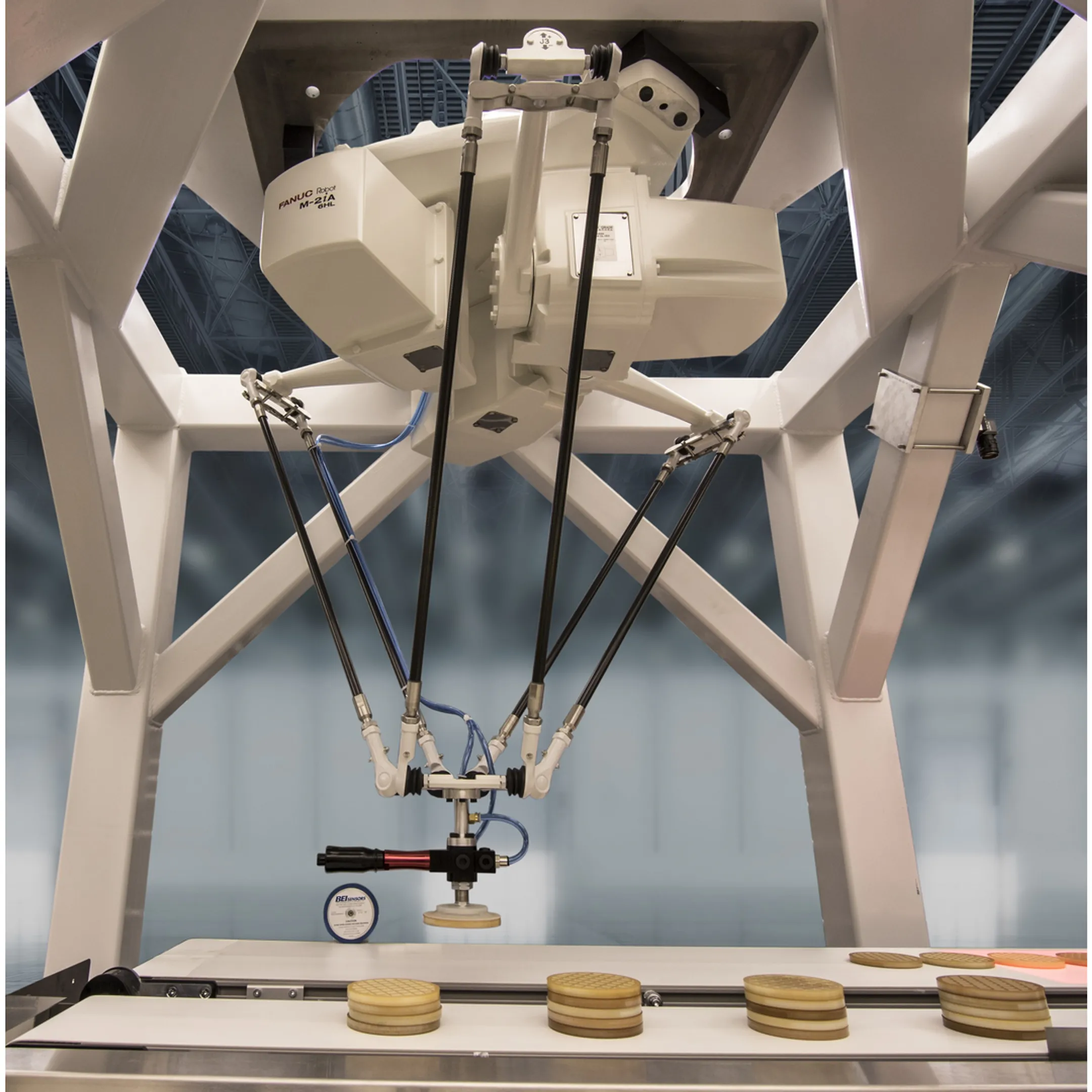 Engineer reviewing a robotic material handling system