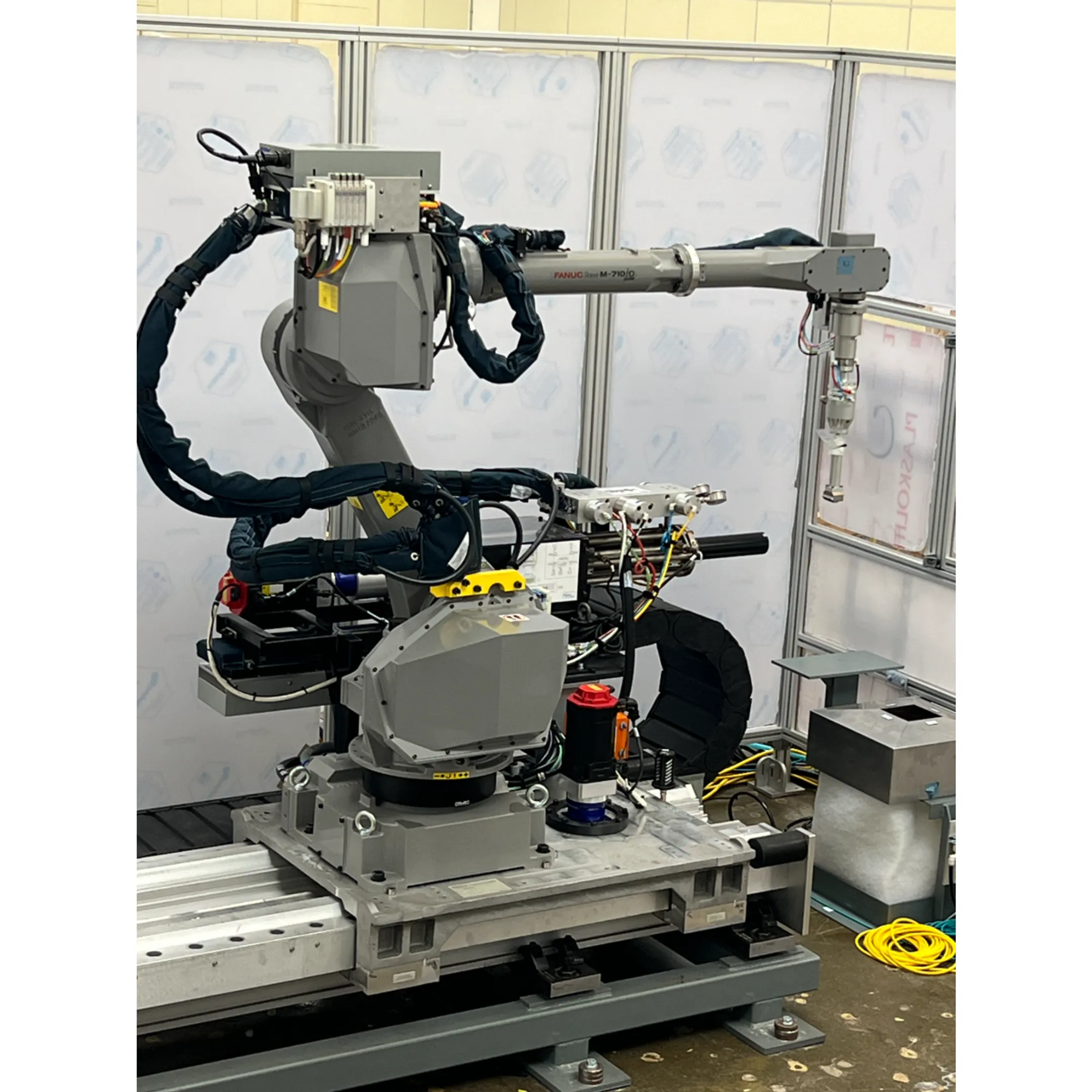 Robotic system dispensing adhesive along a complex three-dimensional joint