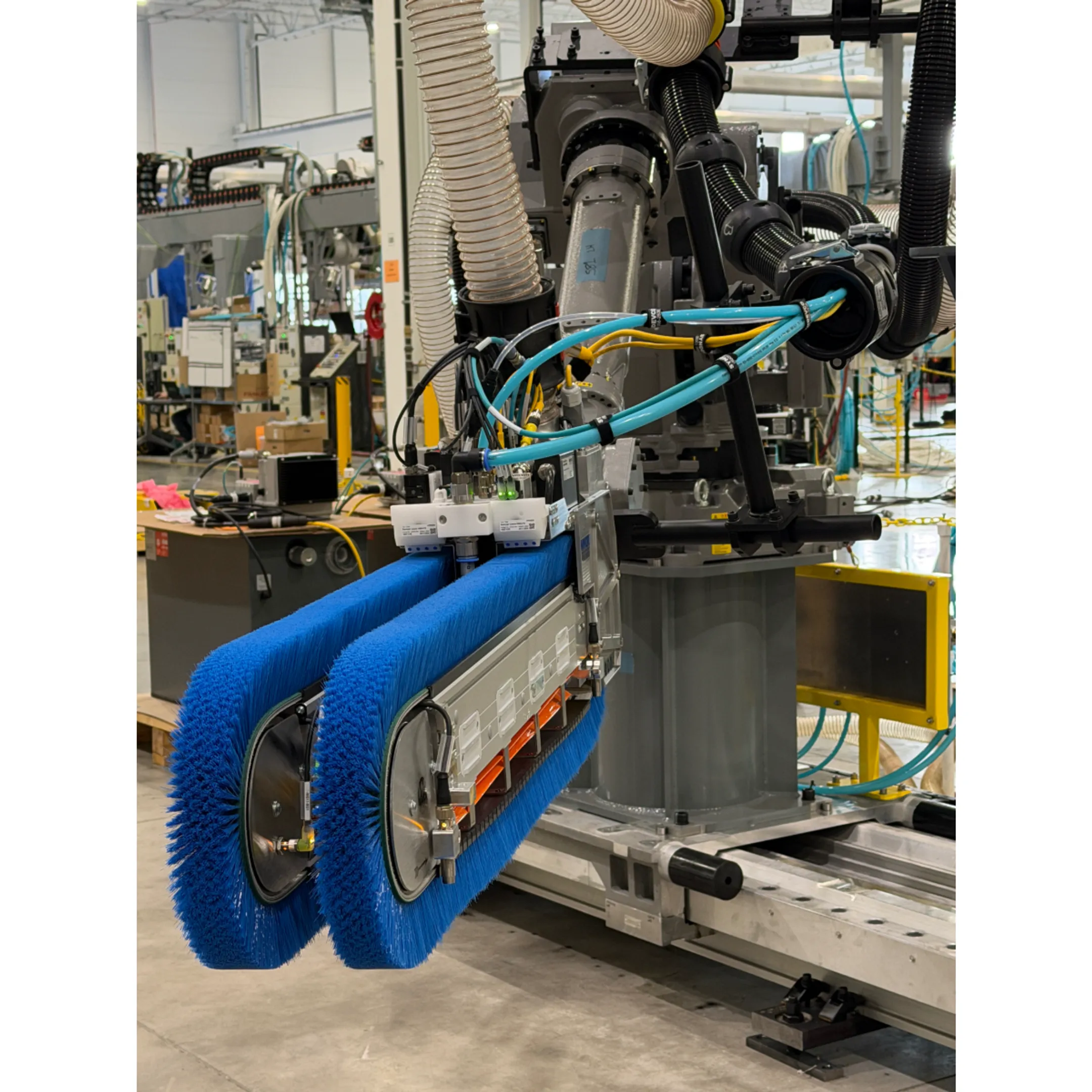Robotic industrial paint and coating system operating inside a finishing booth