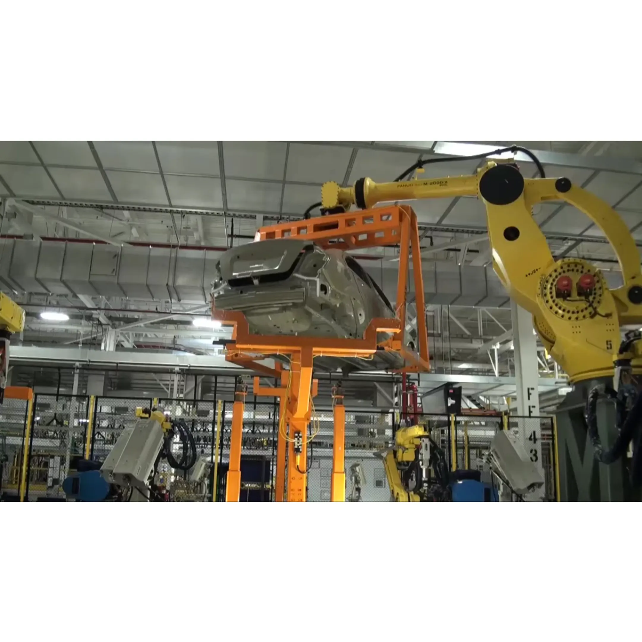 Camera-equipped robot inspecting components during automated manufacturing