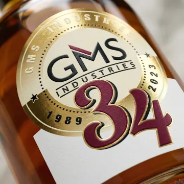 Close-up of premium liquor label with specialty finishing on glass bottle