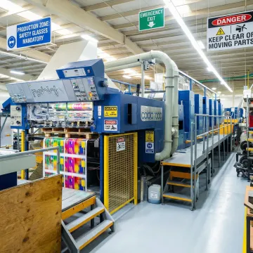 Custom pressure sensitive warning labels on industrial equipment