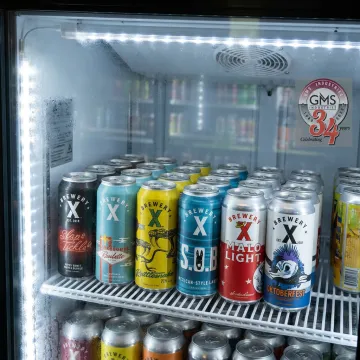 Craft beverage cans with custom shrink sleeve and pressure sensitive labels