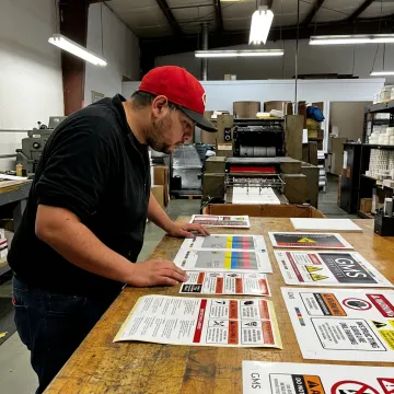Technician checking printed instruction labels