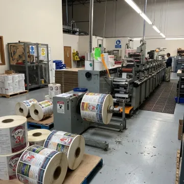 Pressure sensitive label films on production rolls