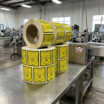Pressure sensitive label films and printed rolls