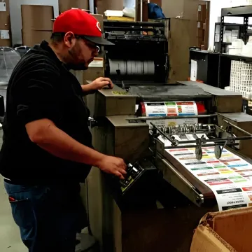 Custom food labels being inspected during printing