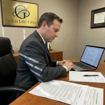 Attorney reviewing purchase and sale agreement documents