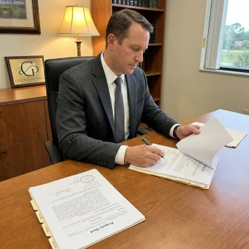 Attorney reviewing deed transfer documents