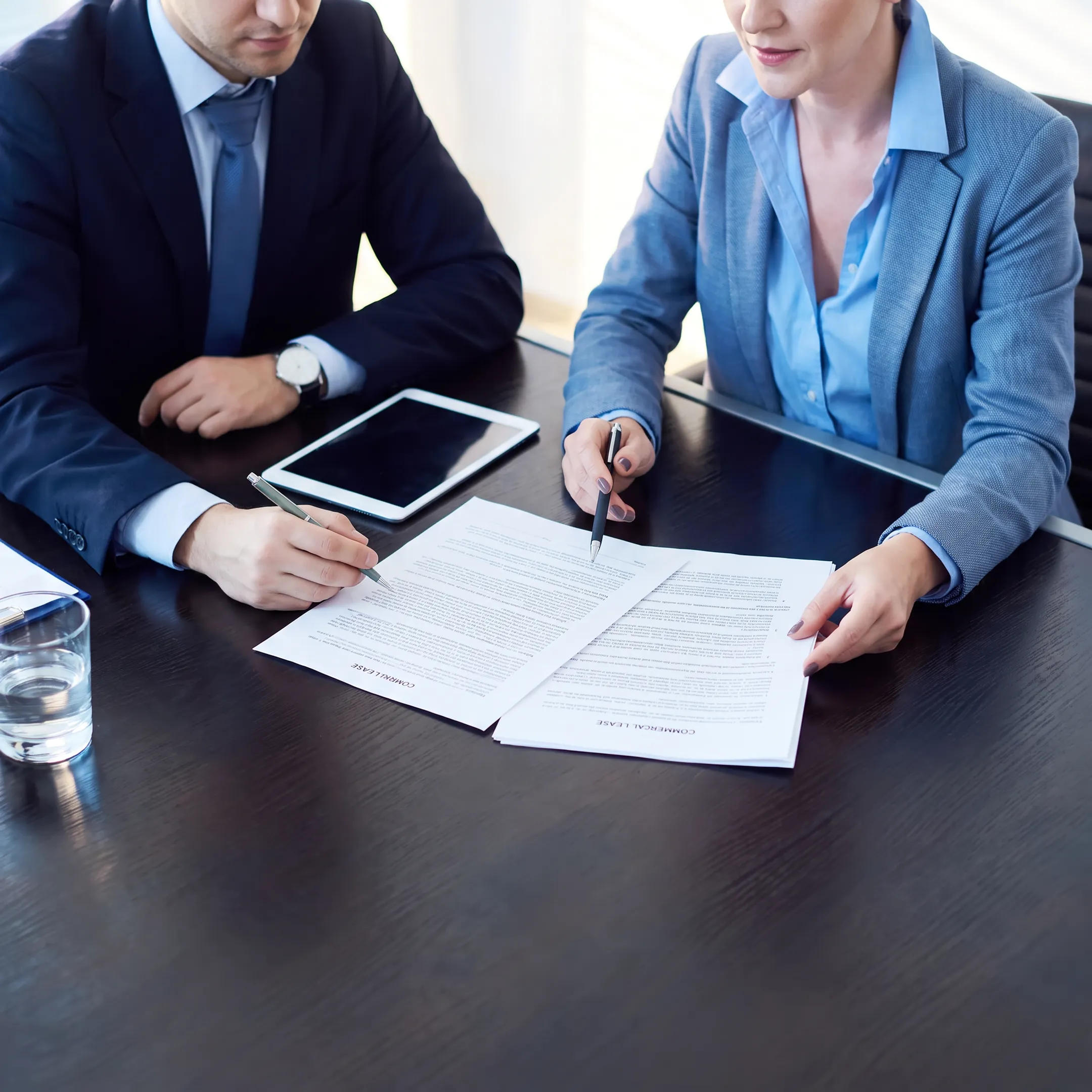 Attorney reviewing a commercial lease with a business client
