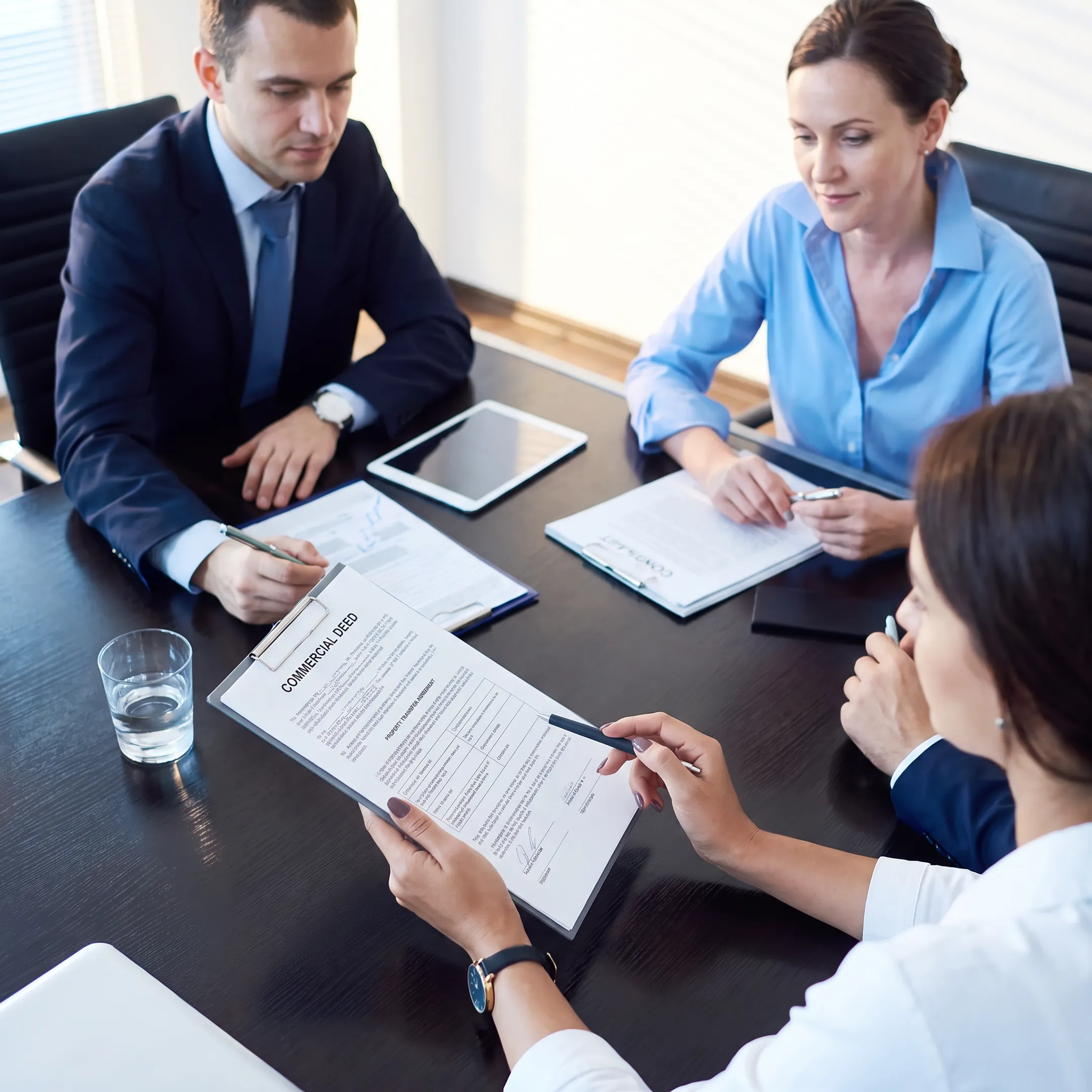 Attorney explaining commercial deed transfer documents