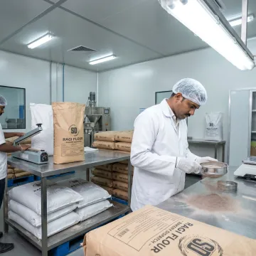 Quality checked ragi flour being packed for delivery
